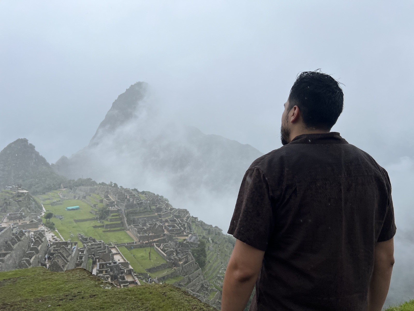 Machu Picchu emerging from the rain and clouds